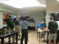 The crew gets some "B-roll" footage of Stacey and Susan looking at family photos.